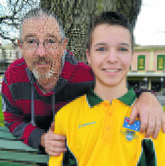 SKY’S THE LIMIT: Trent Gedling, with his father Aaron, before he flew out for a three-week air cadet exchange program to America. Photo: BRIAN WOOD	 071814bwair