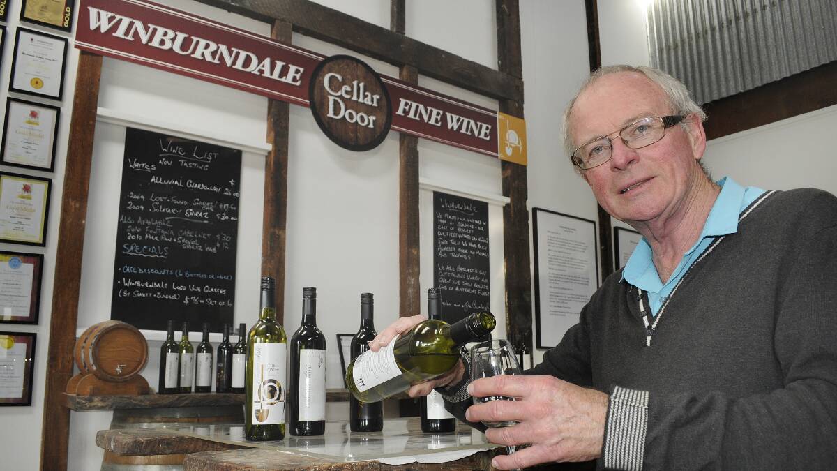 FOOD AND WINE: Glenn Todd at the Winburndale Fine Wine Cellar Door. An application has been lodged to extend the cellar door’s liquor licence to allow patrons to enjoy a glass of wine with meals purchased from the cafe at Crago Mill Emporium. Photo: CHRIS SEABROOK 	040914cwines1