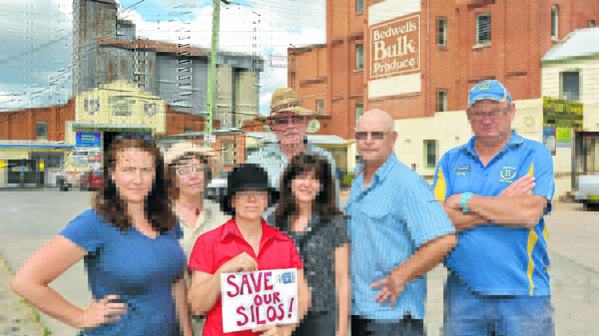 CONCERNED: Bathurst locals Fiona Green, Vianne Tourle, Tracy Sorensen, Graham Priddle, Helen Bergen, Michael Tremain and Chris Frisby say the upcoming sale of the Tremain's Mill could result in the loss of the historic buildings. Photo: ZENIO LAPKA	 020515zsilos1