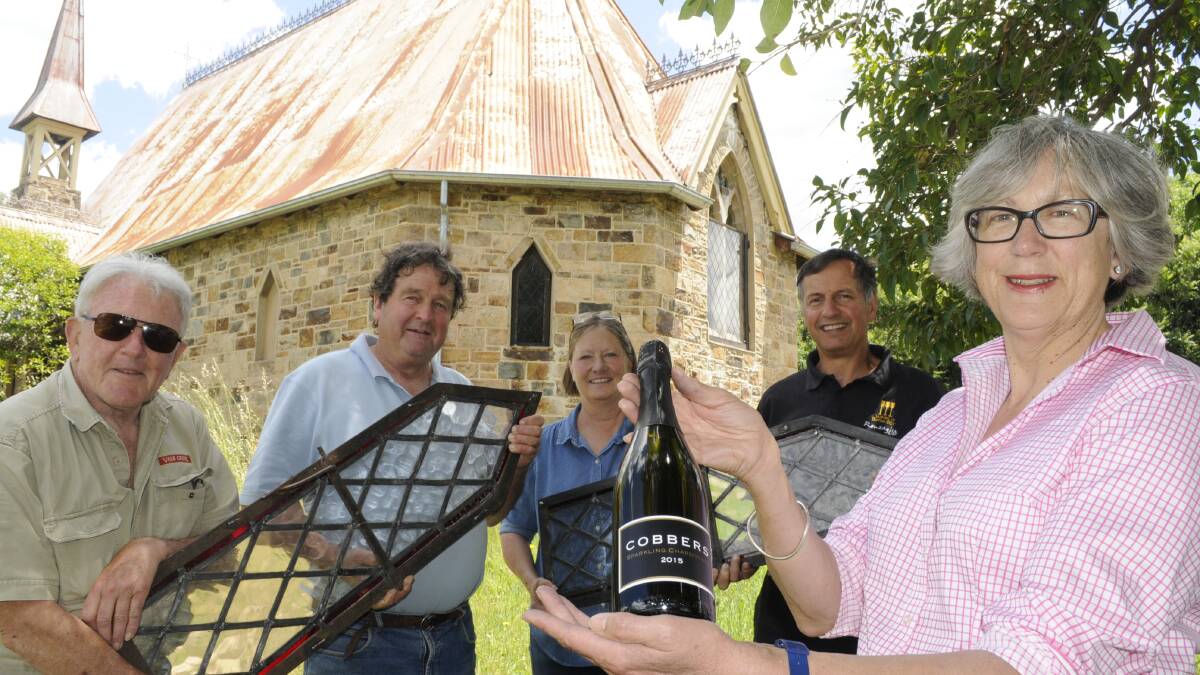 TOP DROP: Reinstating two stained glass windows at the St John's Church at Georges Plains and promoting the release of the Cobbers 2015 sparkling chardonnay are (front) Sarah Macarthur, Tony Hatch, Andrew Macarthur, Sandy and Mark Renzaglia. Photo: CHRIS SEABROOK	 111615cobbers