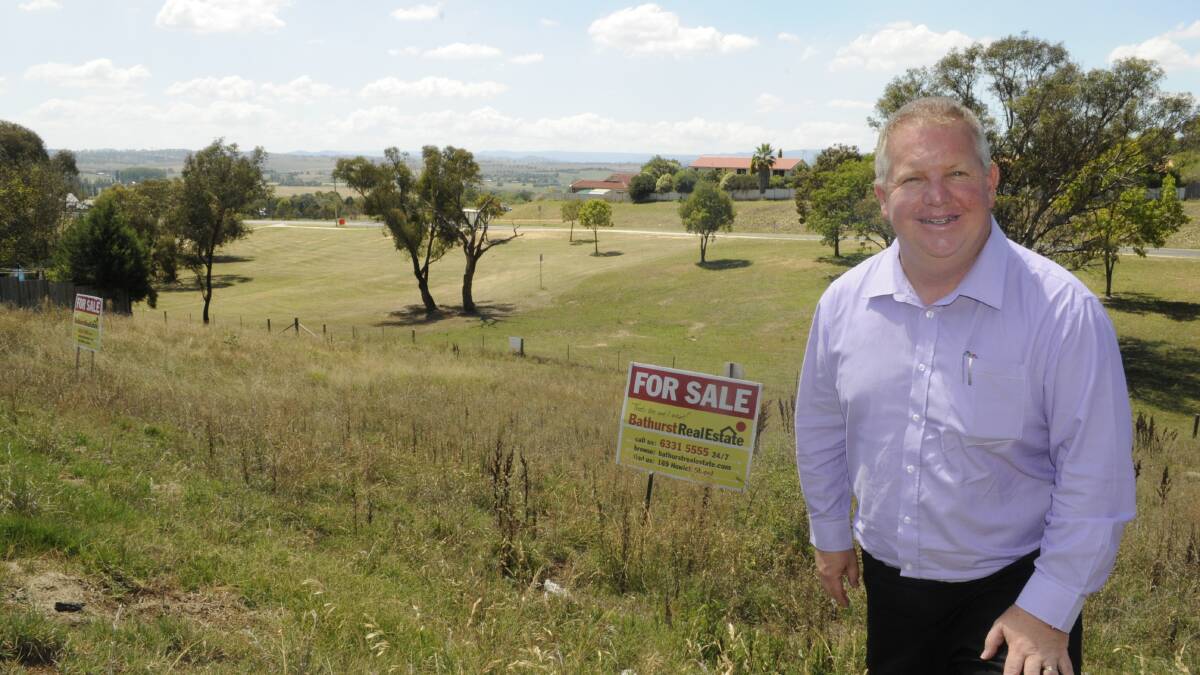 FOR SALE: Bathurst Real Estate principal Michael Whittaker with the $115,000 blocks on Red Gum Place.	030415cforsale
