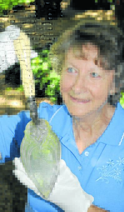TREASURE: Miss Traill’s House collections manager Iris Atkinson holds the  Presentation Trowel from the former St George’s Anglican Church at Brewongle. Photo: CHRIS SEABROOK	 020216ctrowel