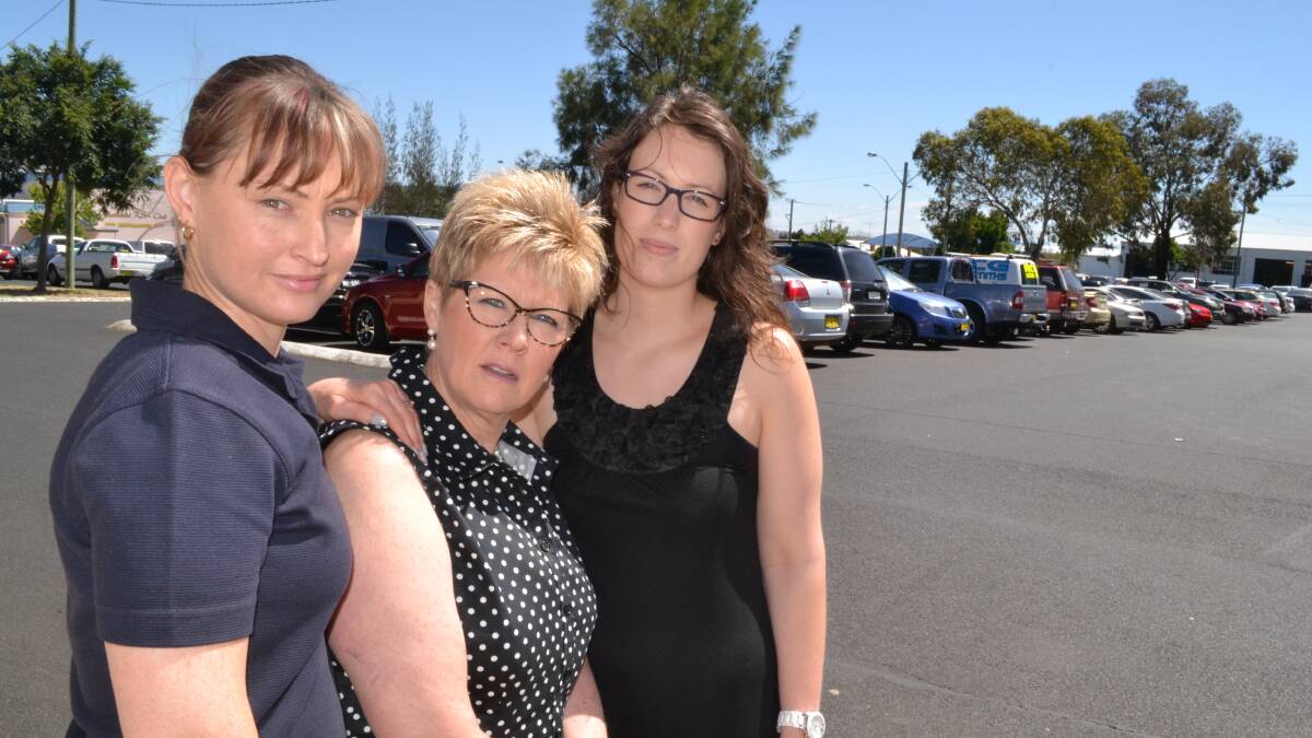 NERVOUS: Crowe Horwath employees Melinda Fulthorpe, Vicki Webb and Hannah Meredith are worried that council will introduce timed parking throughout the RSL car park, leaving them with nowhere to park. Photo: BRIAN WOOD 	112114parking
