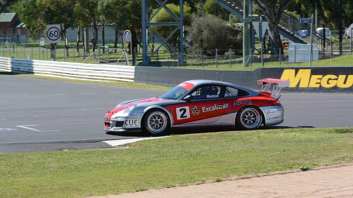 BACK IN CONTROL: While Neale Muston crashed on the final day of the 2013 Bathurst Motor Festival, on Saturday the Porsche driver enjoyed a clean run on his way to victory in the NSW Production Sports Cars driver A race. Photo: PHILL MURRAY	Y 041914pspeed2