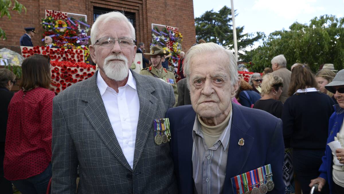 REUNITED: Michael Barrott and his father, Ronald, at the Anzac Day service.	 042515panzac34