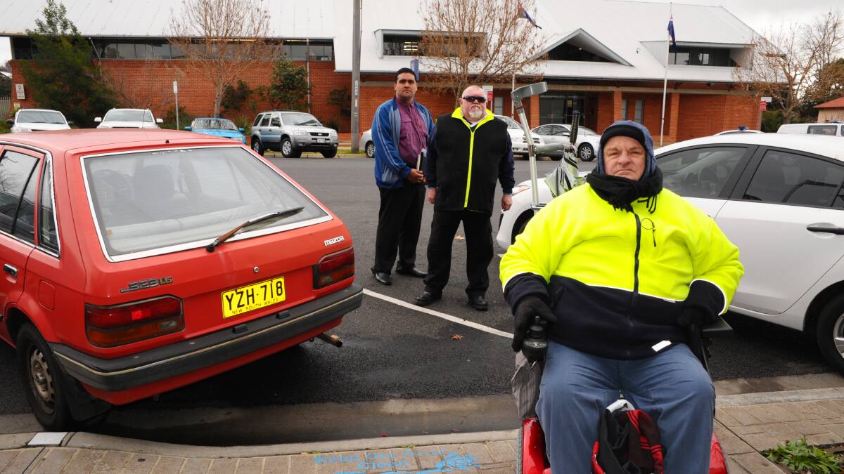 SAFETY CONCERNS: Bathurst Regional Access Committee secretary Bob Triming, vice chairman Ray Wilson and chairman Peter Tully are concerned by the number of motorists who try to squeeze into two Rankin Street disabled parking spots in front of the Bathurst RSL Club. Photo: ZENIO LAPKA 	071814zaccess2