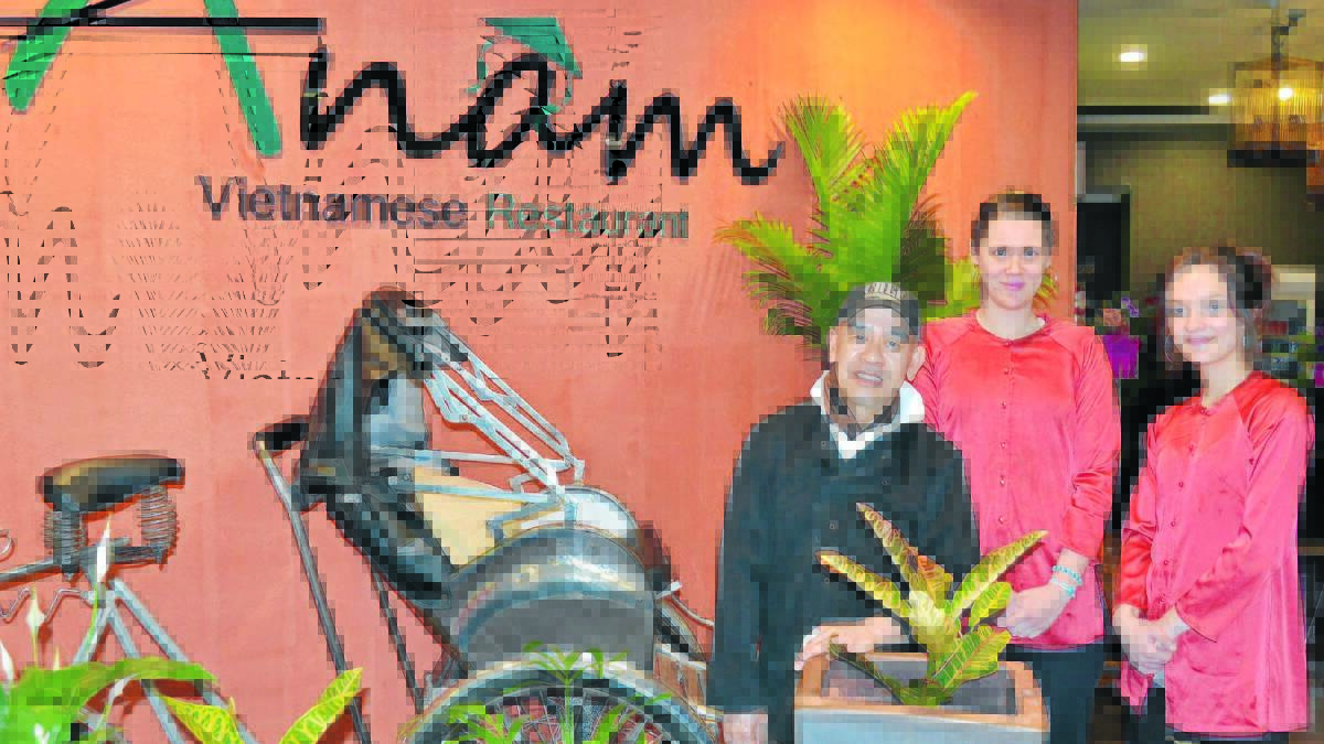 NEW FLAVOURS: Chef James Phans with Kara Pont-Aitchison and Taylor Garlick at Bathurst’s newest international restaurant, Anam Vietnamese Photo: BRIAN WOOD  	 091814anam1