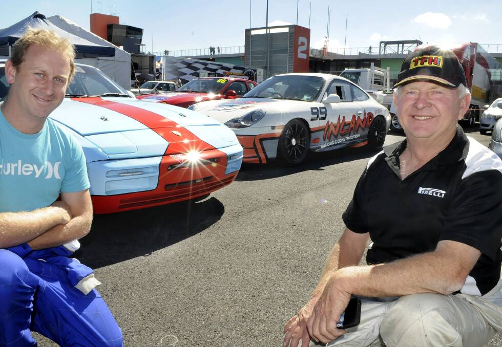 FATHER AND SON: Stuart and Dave Pennells with their Porsches at the Mount Panorama circuit yesterday. Photo: CHRIS SEABROOK 042014cbmf1