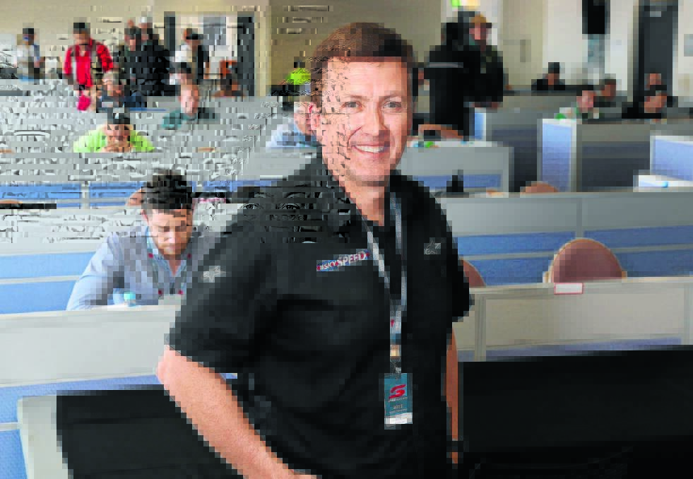 A TRAINED EYE: New Zealand SkySpeed senior sports anchor Stephen McIvor is among a throng of media covering the Bathurst 1000 aciton at Mount Panorama. Photo: PHIL BLATCH