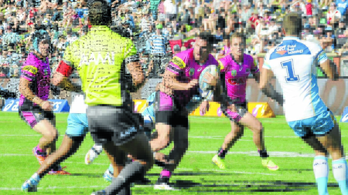 IN THE PINK: Penrith Panthers and Gold Coast Titans in action at Carrington Park in March.