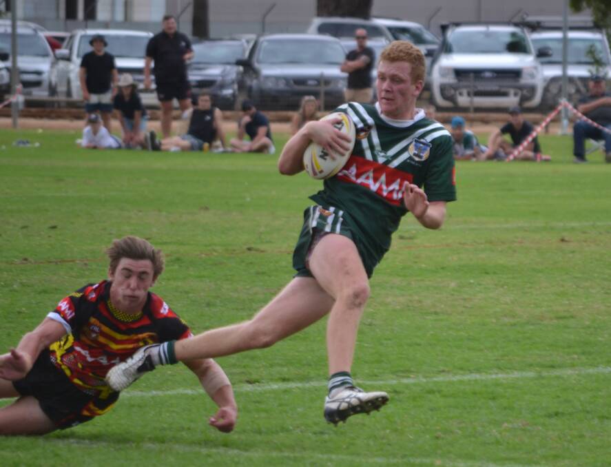 BRUTAL: Panthers talent Adam Fearnley scored one of the 11 tries the under 18 Western Rams ran in against the Greater Southern Redbacks on Saturday. Photo: PETER GUTHRIE	 DSC_0488