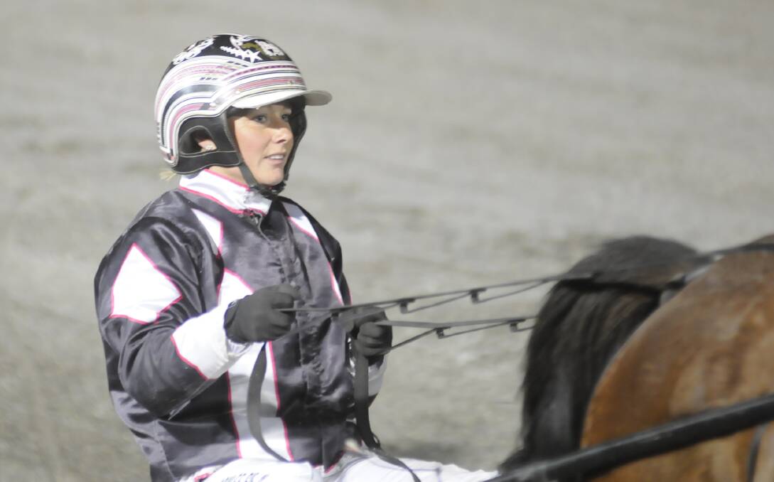 QUINN’S TOO QUICK: Ashlee Siejka found success at Wednesday night’s Bathurst meeting with Wake Up Quinn. Photo: CHRIS SEABROOK 	091615ctrots2