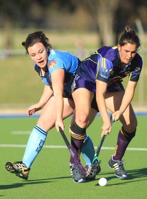 FAITH: Souths’ skipper Candice Falconer (left) works to shut down Lithgow’s Roxsanne Van Veen. While the Panthers beat Falconer’s side 7-1 on Saturday, she still believes the two blues can defeat the competition frontrunners. Photo: PHIL BLATCH	 062715pbsths7