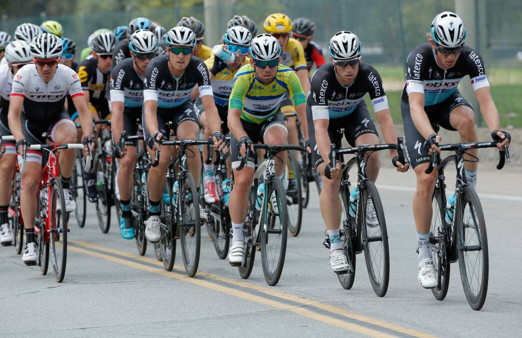 DOING THE HARD YARDS: Bathurst rider Mark Renshaw (second from front) protects QuickStep team-mate Mark Cavendish (third from front) in yesterday’s concluding stage of the Tour of California. Photo: GETTY IMAGES 	051815renshaw
