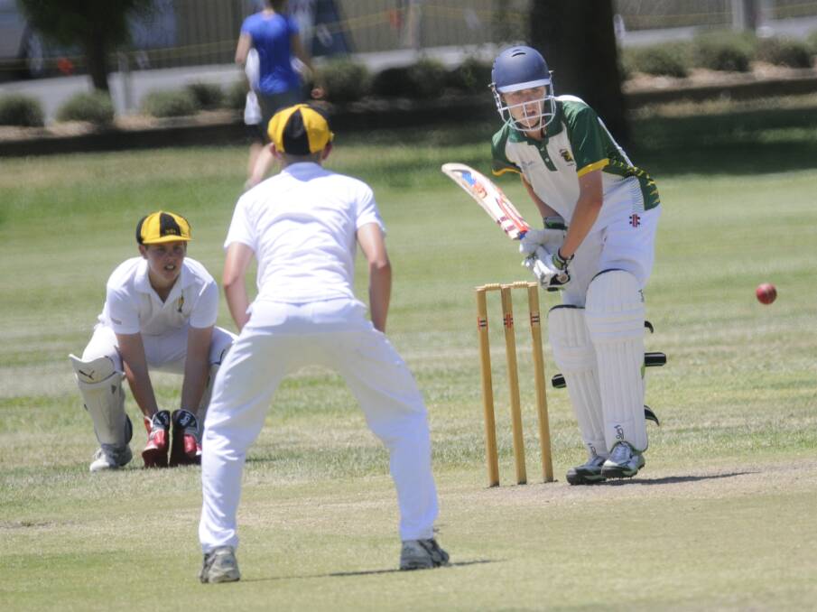 FACING UP: Bathurst’s Brendan Pallier keeps his eye on this delivery in Sunday’s match against the Orange under 14s. Photo: CHRIS SEABROOK 	110914cu14s2a