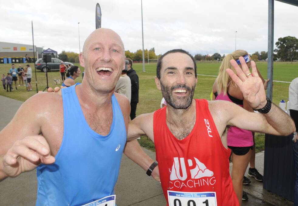 FOUR SURE: Brendan Davies (right) defeated Gary Mullins in a good race for top honours at Sunday’s Bathurst Half Marathon. Photo: CHRIS SEABROOK 	050116cmara1