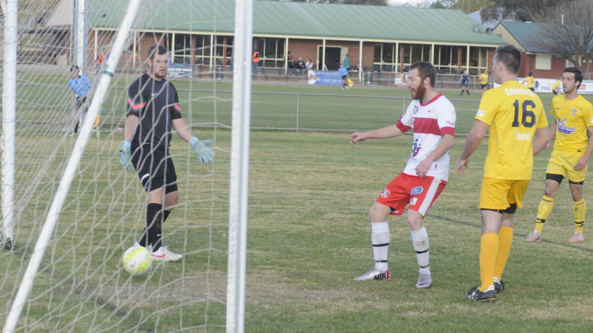HELPLESS: Joshua Brown for CSU scores a goal against wrong-footed Abercrombie FC goalkeeper Chris Minner. Photo: CHRIS SEABROOK 			051715csu4