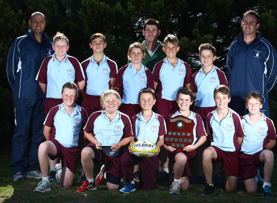 SEVENTH HEAVEN: The Holy Family sevens team to contest the NSW finals today, from left, back: Joe Pucci (coach), Caden Taylor, Kyle Allen, Tyrese Tilley, Mick Rossitt (manager), Kale Roulard, Will Brown and Dane Fitzpatrick (coach). Front: Thomas Judge, Ryan Howarth, James Pucci, Vinny Rossitt, Tyler Sharwood and Dylan Thurston. Photo: PHIL BLATCH 	051916pbholy1