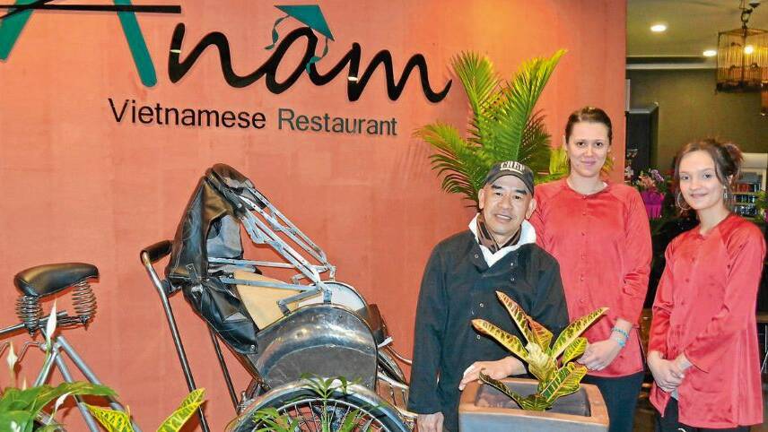 NEW FLAVOURS: Chef James Phans with Kara Pont-Aitchison and Taylor Garlick at Bathurst’s newest international restaurant, Anam Vietnamese Photo: BRIAN WOOD 091814anam1