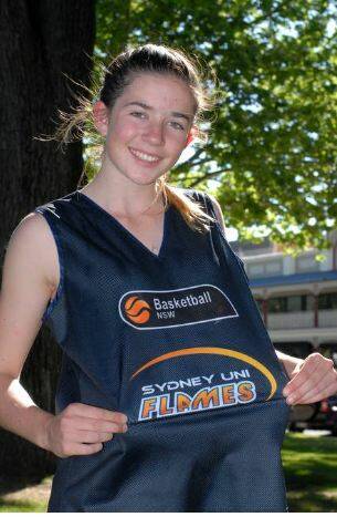 NEW COLOURS: Emily Matthews shows off some of her Sydney Flames attire after being included in a Flames development program recently. Photo: ZENIO LAPKA 103014zmatthews1