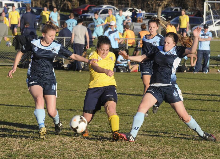 DOUBLE VISION: Jessica Salomoni (centre) scored twice in Sunday’s match against Southern Districts to ensure the Western NSW Mariners FC won the 2015 Women's State League minor premiership. Photo: CHRIS SEABROOK 	082414cmarinw1