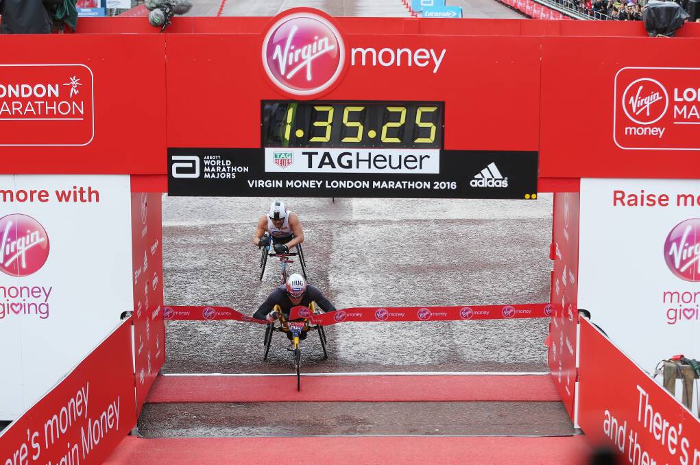 SO CLOSE: Marcel Hug beats Carcoar native Kurt Fearnley in a sprint to the line in yesterday’s London Marathon. Photo: GETTY IMAGES 				042516kurt