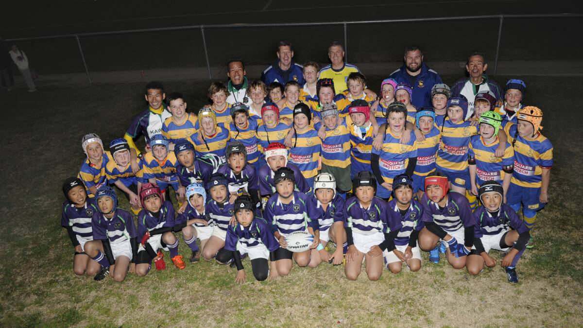 INTERNATIONAL FLAVOUR: Bathurst Bulldogs juniors with the touring Kawanishi Rugby School team, prior to their match at Ashwood Park on Wednesday evening. Photo: CHRIS SEABROOK 	073014cjapan1