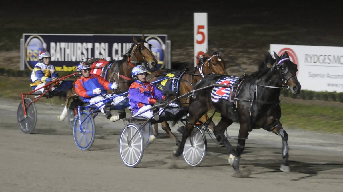 SUPREME SPEED: Mat Rue with Fouroeight wins the Alabar NSW Breeders Challenge Three Year Old Colts and Geldings Heat at the Bathurst Paceway on Wednesday night ahead of Sams The Master (#7) and War Dan Apollo (#1). Photo: CHRIS SEABROOK 	052516ctrots1a