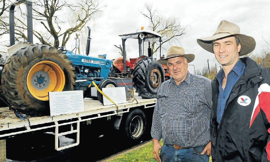 ALL ABOARD: Geoff and Kevin Porter are ready with their tractors for another tilt at the Camp Quality Tractor Trek next month. The trek will travel through the towns and villages of the Central West. Photo: PHILL MURRAY