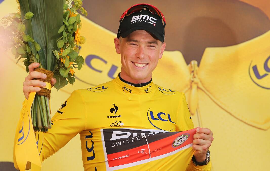 HAPPY IN YELLOW: Rohan Dennis was the first man to wear the yellow jersey in this year's Tour de France. His average speed for the 13.8km individual time trial was 55.446km/hr, the fastest ever recorded on a Tour de France time trial. Photo: GETTY IMAGES