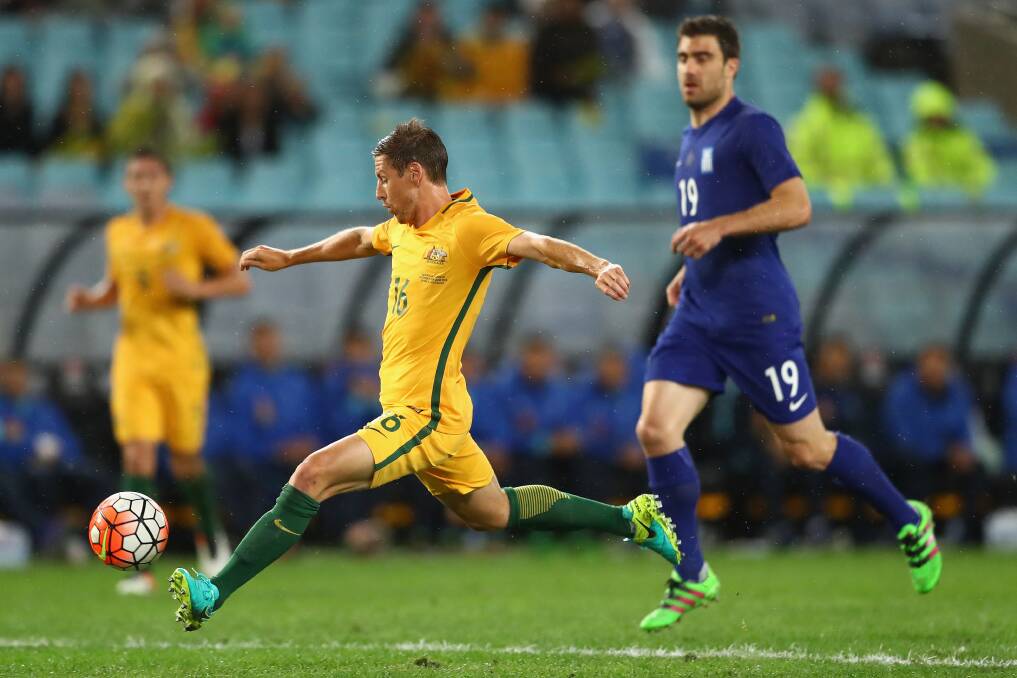 AIMING UP: Socceroo Nathan Burns takes a shot at goal during the international friendly match between Australia and Greece at ANZ Stadium on Saturday night. Tonight the Bathurst ’75-Western graduate will take on the Greeks once more. Photo: GETTY IMAGES	 060616burns