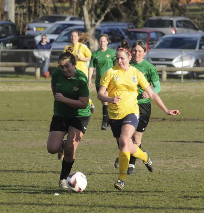 NOT PANICKING: Kya Godbier (right) and her Mariners team-mates had two losses on the weekend but retained top spot in the women’s State League competition. Photo: CHRIS SEABROOK	080915cmarins5