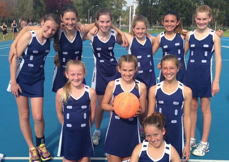 WINNERS ARE GRINNERS: The Bathurst Public School netball team were all smiles after taking out the Western Region Championship last Thursday.	 052215netball
