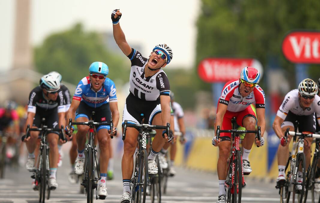 HE MADE IT: Bathurst rider Mark Renshaw (left) places fifth behind Marcel Kittel in the final stage of the Tour de France. Photo: GETTY IMAGES	 072814renshaw