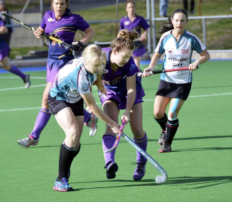 GRAND FINAL BOUND: Bathurst City’s Ivy Moore fights her way up the field in Saturday’s 2-0 major semi-final win over the Lithgow Panthers while team-mate Kelsey Willott watches on. Photo: JEFF 
GEDDES 	082314city
