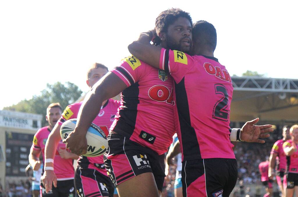 WELL DONE: Jamal Idris is congratulated by his Penrith team-mate George Jennings after scoring one of his three tries at Carrington Park on Saturday afternoon. Photo: GETTY IMAGES