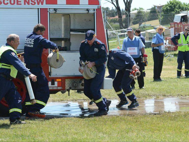 LOCAL BOYS: The Kelso brigade may not have won, but they certainly earned their place in the top three after their strong efforts at the Firefighters State Championships. Pictured are Shane Kearney, Lance McKenzie and Graham Gibbons. Photo: PHILL MURRAY 102514pfire12