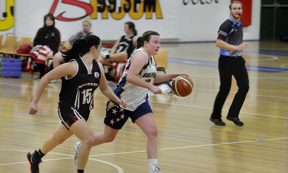 ATTACKING WEAPON: Bathurst Goldminer Chelsea Noon (right) has scored 113 points this season and will be looking to make a substantial increase on that tally on Sunday when her side takes on the Sydney Comets. Photo: CHRIS SEABROOK 	061414cwgoldm5
