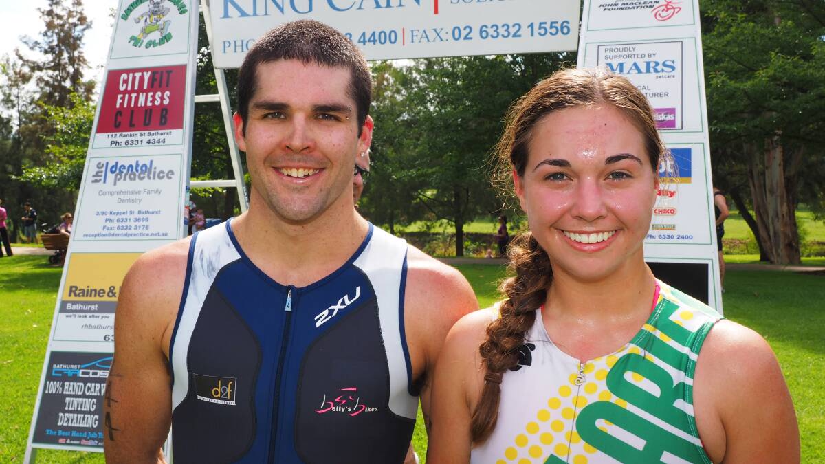 WINNERS ARE GRINNERS: Nick North and Lucy Hobson  were the first male and female competitors to finish the Dave Carroll/Dave Scott Memorial Triathlon long course race on Sunday. Photo: CHRIS SEABROOK 	032314zwinners
