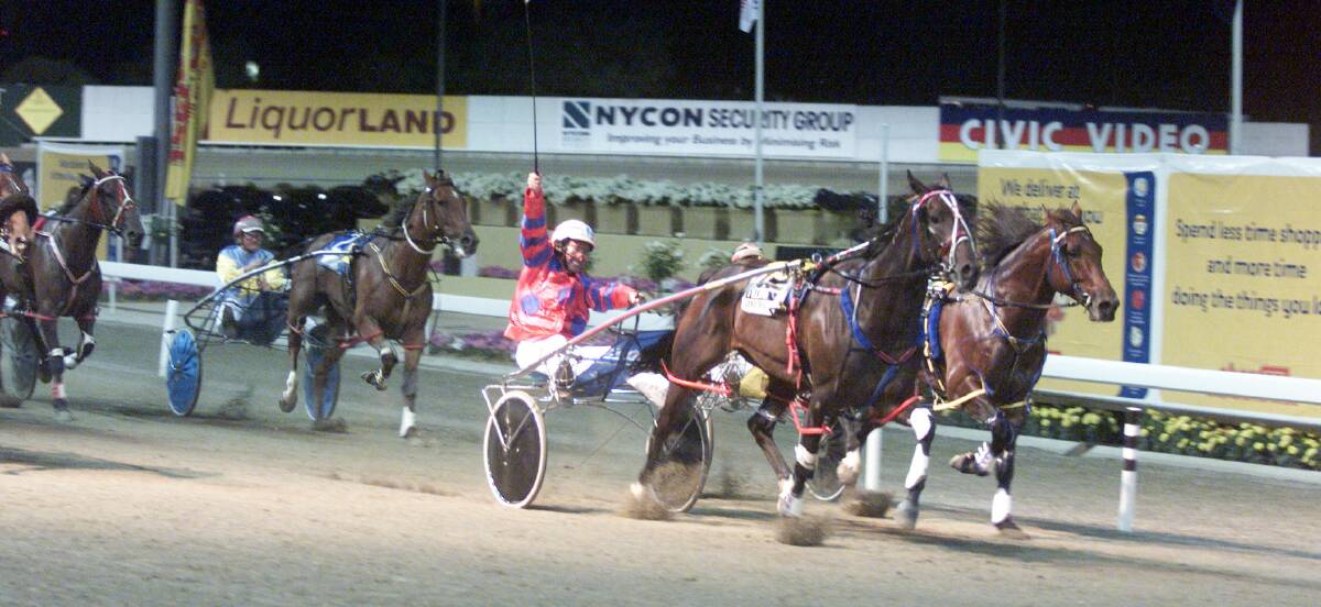 MEMORIES: The Lagoon trainer-driver Steve Turnbull salutes after winning the 2002 Inter Dominion with Smooth Satin. Turnbull says a current member of his stable, three-year-old Power Of Red, is his most promising horse since Smooth Satin. 	120715smoothsatin