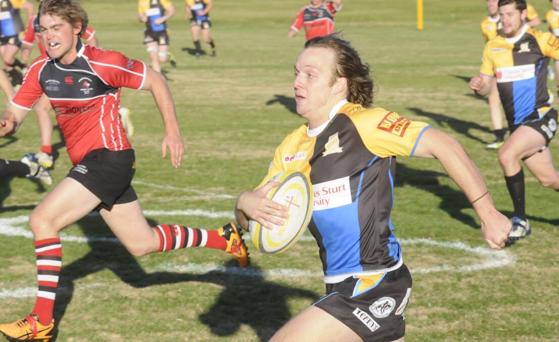 OFF THE MARK: James Tooth makes a break down the left wing for CSU in the side’s 36-12 win over the Narromine Gorillas on Saturday at University Oval. Photo: CHRIS SEABROOK 	051615csu1