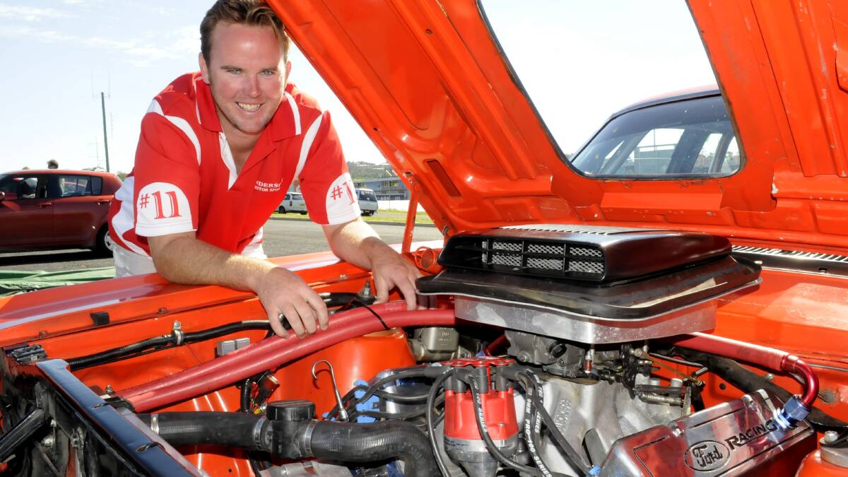 KEEPING CLEAN: Michael Anderson with his Ford XY Falcon GT-HO 3. Photo: CHRIS SEABROOK 	042014cbmf2