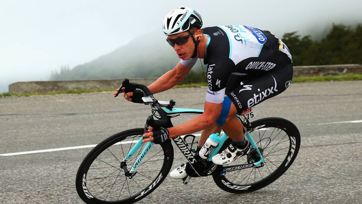 SUCCESS: Mark Renshaw’s Omega Pharma-QuickStep team-mate Tony Martin rides his way to victory in the ninth stage of the 2014 Tour de France. Photo: GETTY IMAGES 	071414martin