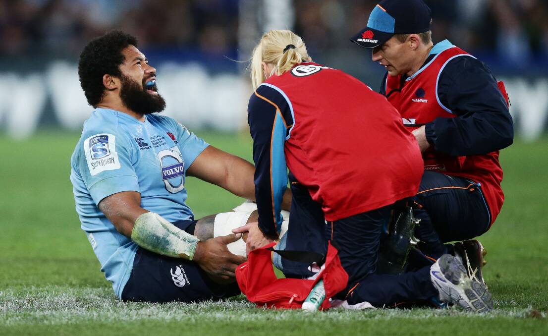 OUCH: Waratahs hooker Tatafu Polota-Nau of the Waratahs lays on the field injured during the Super Rugby grand final against the Crusaders. It means he is unlikely to be in Bathurst this Thursday. Photo: GETTY IMAGES
