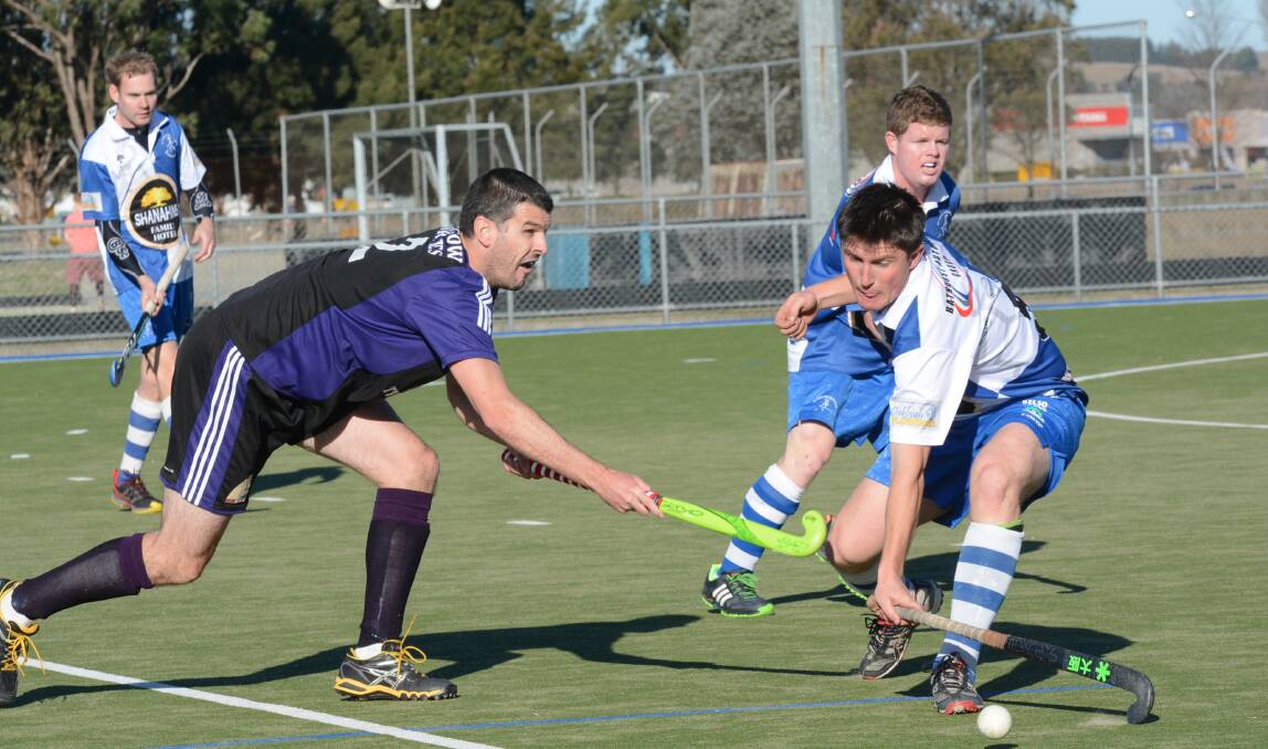 ON TOP: Josh Toole (right) goes after the ball for St Pat’s in their 6-2 win over the Lithgow Panthers on Saturday. Photo: PHILL MURRAY 	080914ppats7