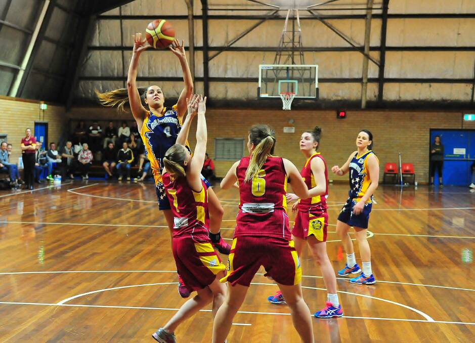 NOT TO BE: Hannah Cafe eyes off the basket in the Bathurst Goldminers’ 82-59 defeat to the Queanbeyan Yowies in Saturday’s women’s State League Division 1 basketball semi-final. Photo: NOEL ROWSELL www.photoexcellence.com.au 	080115cafe