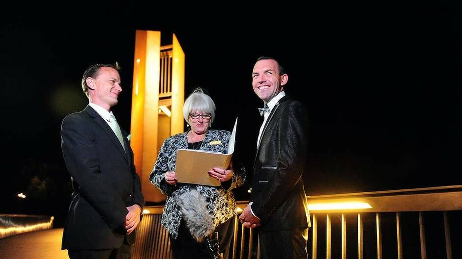 ACT celebrant Sharyn Gunn officiates over Australia's first Australian legal same sex marriage between Alan Wright (L)and Joel Player, at one minute past 12 midnight. Photo: karleen Minney