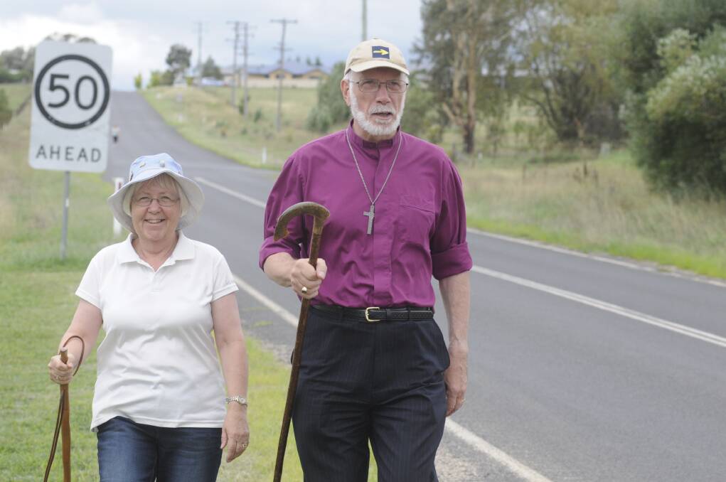 THE WINDING ROAD: Elizabeth and Bishop Ian Palmer tread the path they will walk between Bathurst and Dubbo. Photo: CHRIS SEABROOK 011415cbishop