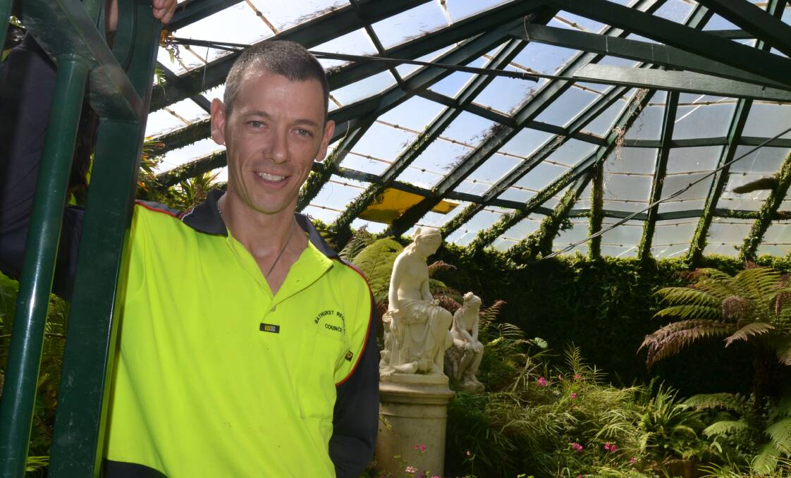 FIX IT: Daniel Watson from Bathurst Regional Council’s parks staff inside the heritage-listed Machattie Park fernery. Part of the roof needs fixing to ensure the iconic building remains in tip-top condition despite being more than 100 years old. Photo: BRIAN WOOD 031814bwfernery