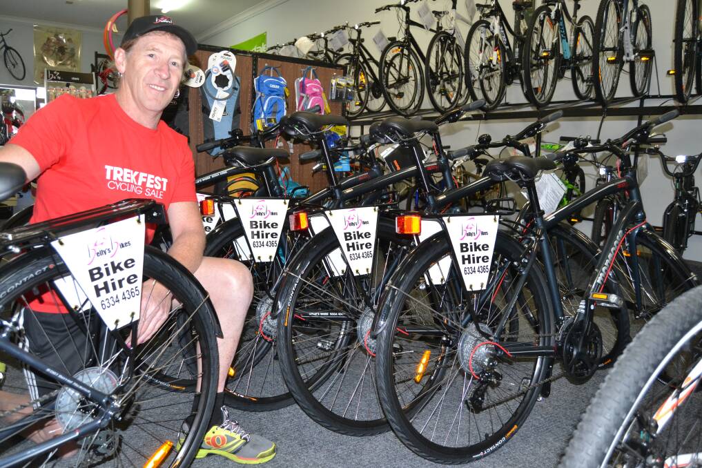 GO FOR A SPIN: Greg Bell from Belly’s Bikes has introduced bicycle hire to his business in a show of faith in the region as a bike-friendly destination. Photo: BRIAN WOOD  041414bwbikes